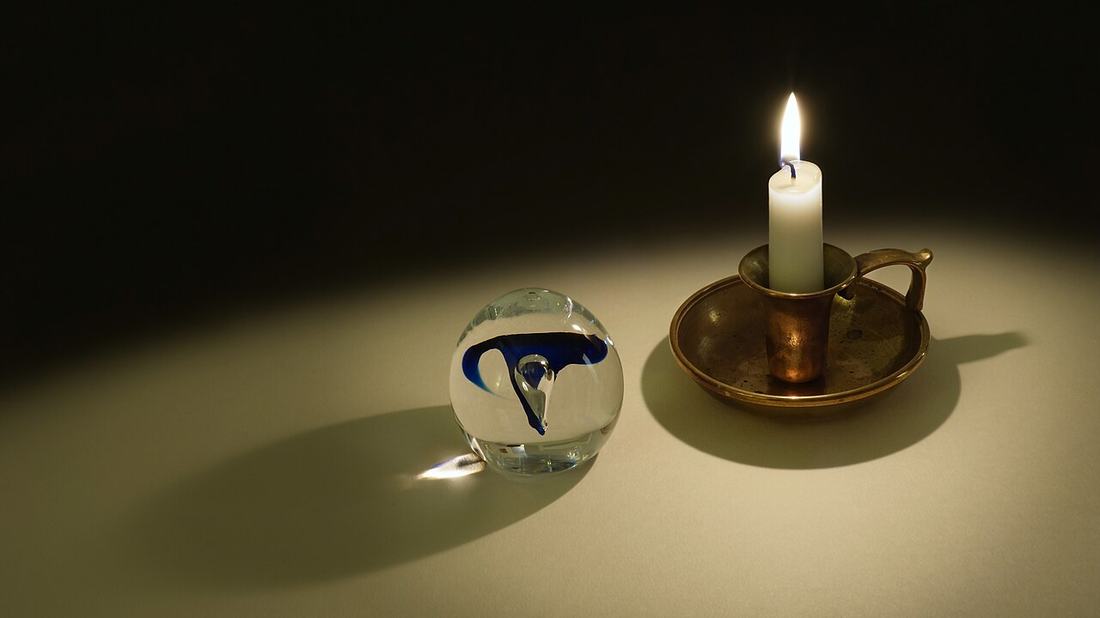Candle light through a glass orb